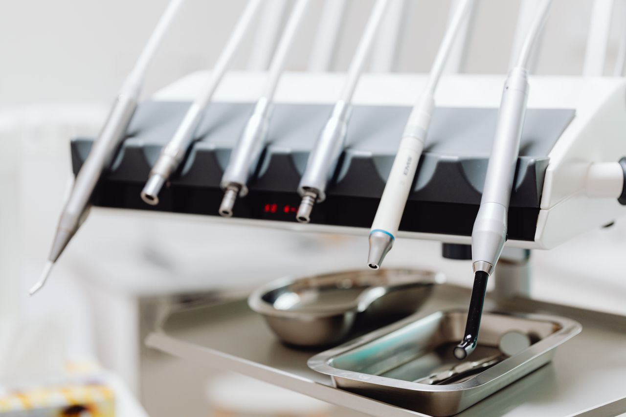 why-choose-us High-tech dental tools and instruments in a dental clinic setting, showcasing advanced healthcare technology.